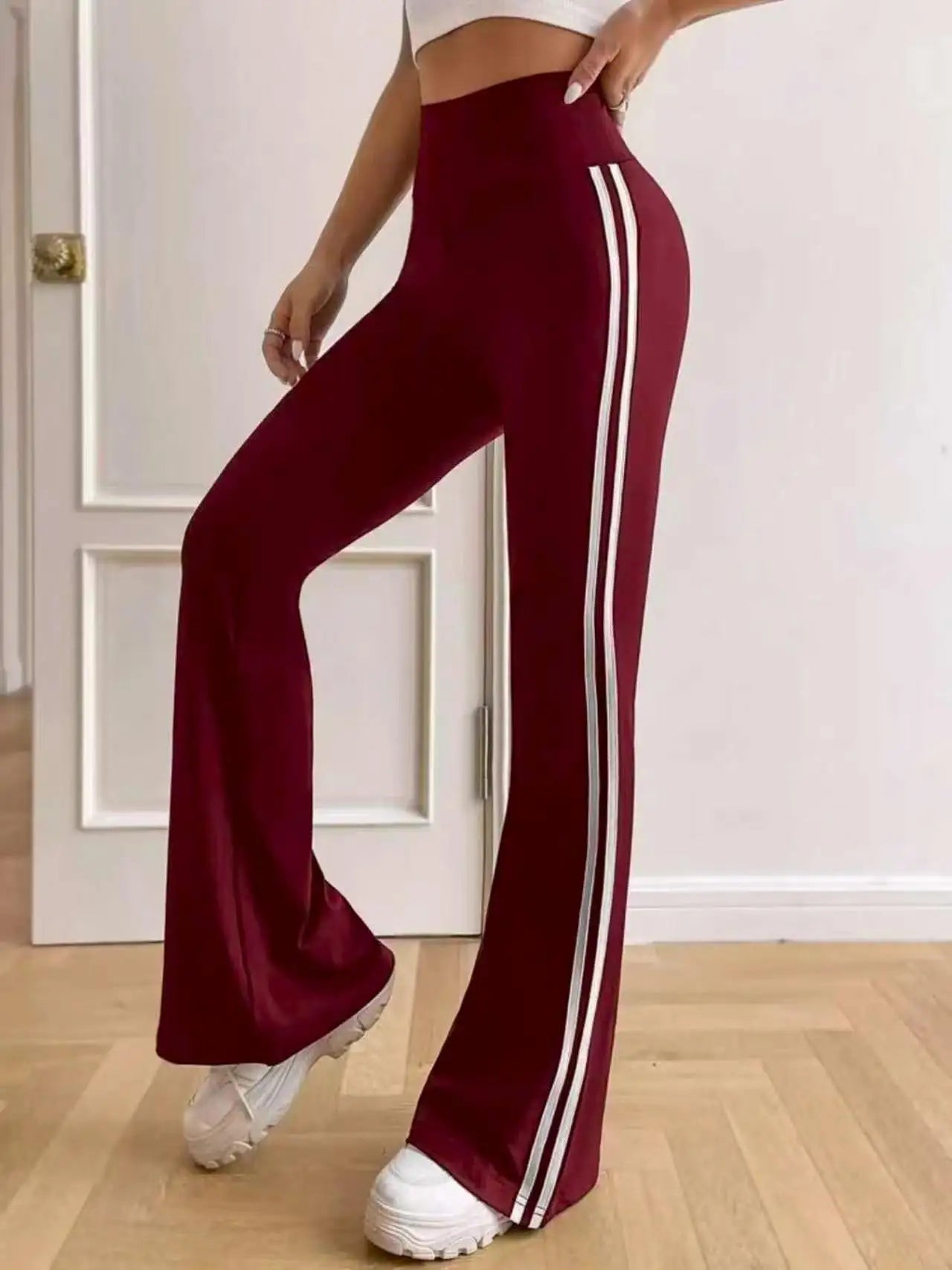 Dames flared sportbroek met zijstrepen