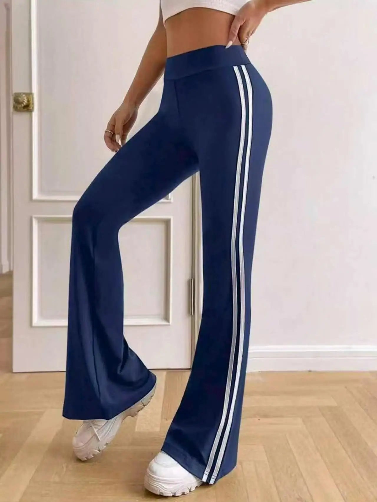 Dames flared sportbroek met zijstrepen