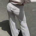 Dames flared yoga leggings met borduurdetail en fold-over tailleband